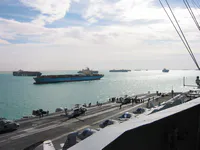 USS George Washington flight deck with shipping traffic during Suez Canal transit
