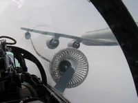 RIPPER 200 (163227) plugged on a KC-135 Wing Air Refueling Pod (WARP) on left wing. Lefty driving into the basket.
