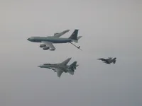 RIPPER 201 (162912) waiting patiently for an F-16 Falcon with 2x AIM-120 AAMRAMs on wingtip stations and a 500 lb GBU-38 JDAM (Joint Direct Attack Munition).  KC-135 Registration / Serial Number: 63-8884 (a Boeing KC-135R Stratotanker), 92nd Air Refueling Wing, operating out of Fairchild Air Force Base, Washington., configured with centerline boom for Air Force aircraft and MPRS (Multi-point Refueling System) and a Wing Air Refueling Pod (WARP) on left wing.