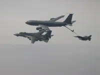 RIPPER 201 (162912) waiting patiently for an F-16 Falcon with 2x AIM-120 AAMRAMs on wingtip stations and a 500 lb GBU-38 JDAM (Joint Direct Attack Munition).  KC-135 Registration / Serial Number: 63-8884 (a Boeing KC-135R Stratotanker), 92nd Air Refueling Wing, operating out of Fairchild Air Force Base, Washington., configured with centerline boom for Air Force aircraft and MPRS (Multi-point Refueling System) and a Wing Air Refueling Pod (WARP) on left wing.