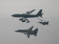 RIPPER 201 (162912) waiting patiently for an F-16 Falcon with 2x AIM-120 AAMRAMs on wingtip stations and a 500 lb GBU-38 JDAM (Joint Direct Attack Munition).  KC-135 Registration / Serial Number: 63-8884 (a Boeing KC-135R Stratotanker), 92nd Air Refueling Wing, operating out of Fairchild Air Force Base, Washington., configured with centerline boom for Air Force aircraft and MPRS (Multi-point Refueling System) and a Wing Air Refueling Pod (WARP) on left wing.