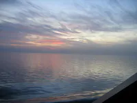 Persian Gulf sunset photographed from the hangar bay aboard USS George Washington.