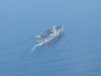 USS George Washington clearing the landing area.
