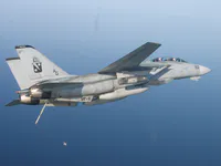 RIPPER 207 (161437) low holding over GW, hook down, flying over S-3 launch.