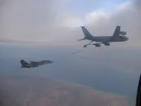RIPPER 200 (163227) heading to plug on the KC-135, GBU-16s on belly.