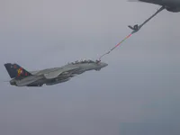 RIPPER 200 (163227) plugged on the KC-135, GBU-16s on belly, closeup.