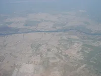 Wide aerial view of city, Tigris River and airfield