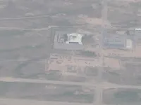Military airfield/storage complex with numerous dispersed structures or revetments