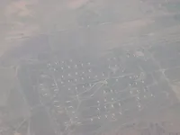 Closer view of runway threshold, taxiways and military airfield infrastructure