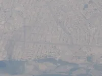 Dense riverside town/city and bridge/road network along the Tigris