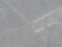 Military airfield and nearby town; probably associated with the same general complex as preceding storage photos