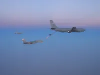 Blurry shot of RIPPER Tomcat, Hornet, and KC-135 tanker with centerline Iron Maiden
