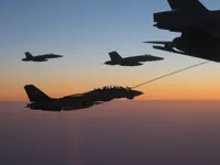 RIPPER 200 (163227) with 2x GBU-16s plugging on KC-10A Extender tanker serial 79-1713 with 2x F/A-18C waiting