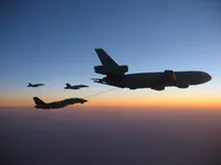 RIPPER 200 (163227) with 2x GBU-16s plugging on KC-10A Extender tanker serial 79-1713 with 2x F/A-18C waiting
