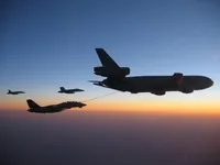 RIPPER 200 (163227) with 2x GBU-16s plugging on KC-10A Extender tanker serial 79-1713 with 2x F/A-18C waiting
