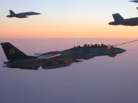 RIPPER 200 (163227) with 2x GBU-16s plugging on KC-10A Extender tanker serial 79-1713 with 2x F/A-18C waiting