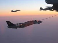RIPPER 200 (163227) with 2x GBU-16s plugging on KC-10A Extender tanker serial 79-1713 with 2x F/A-18C waiting