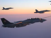 RIPPER 200 (163227) with 2x GBU-16s plugging on KC-10A Extender tanker serial 79-1713 with 2x F/A-18C waiting