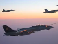 RIPPER 200 (163227) with 2x GBU-16s plugging on KC-10A Extender tanker serial 79-1713 with 2x F/A-18C waiting