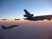 RIPPER 200 (163227) with 2x GBU-16s plugging on KC-10A Extender tanker serial 79-1713 with 2x F/A-18C waiting