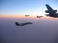 RIPPER 200 (163227) with 2x GBU-16s detaching from KC-10A Extender tanker serial 79-1713 with 2x F/A-18C waiting
