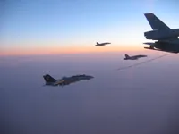 RIPPER 200 (163227) with 2x GBU-16s detaching from KC-10A Extender tanker serial 79-1713 with 2x F/A-18C waiting