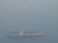 USS George Washington (CVN-73) in the setting sun