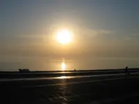 USS George Washington (CVN-73) and the setting sun off the port side
