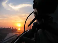 Lefty shooting the sunset over his shoulder on CVN-73