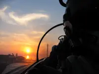 Lefty shooting the sunset over his shoulder on CVN-73