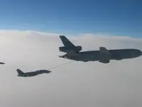 RIPPER 207 (161437) with 2x GBU-16s and LANTIRN plugged on USAF KC-10A Extender, serial 86-0036, AG-100 peeking in shot with 2x GBU-16s