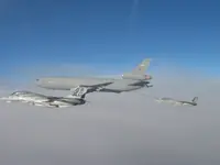 USAF KC-10A Extender, serial 86-0036, AG-100 plugged with 2x GBU-16s, AG-105 waiting on port side with 2x GBU-16s