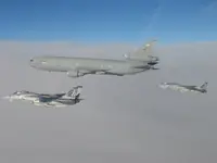 USAF KC-10A Extender, serial 86-0036, AG-100 plugged with 2x GBU-16s, AG-105 waiting on port side with 2x GBU-16s
