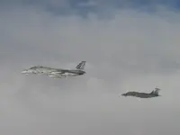 AG-105 and AG-100 on starboard side of KC-10 with 2x GBU-16s each