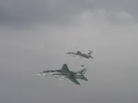 AG-105 and AG-100 on starboard side of KC-10 with 2x GBU-16s each