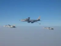 2x AG-1xx Tomcats with 2x GBU-16s each tanking with USAF KC-135R Stratotanker serial 62-3502