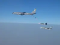 2x AG-1xx Tomcats with 2x GBU-16s each tanking with USAF KC-135R Stratotanker serial 62-3502