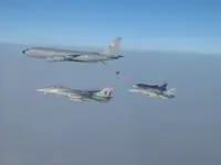 RIPPER 201 (162912) in port holding with 2x AG-1xx Tomcats with 2x GBU-16s each tanking with USAF KC-135R Stratotanker serial 62-3502