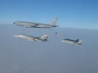 RIPPER 201 (162912) in port holding with 2x AG-1xx Tomcats with 2x GBU-16s each tanking with USAF KC-135R Stratotanker serial 62-3502.